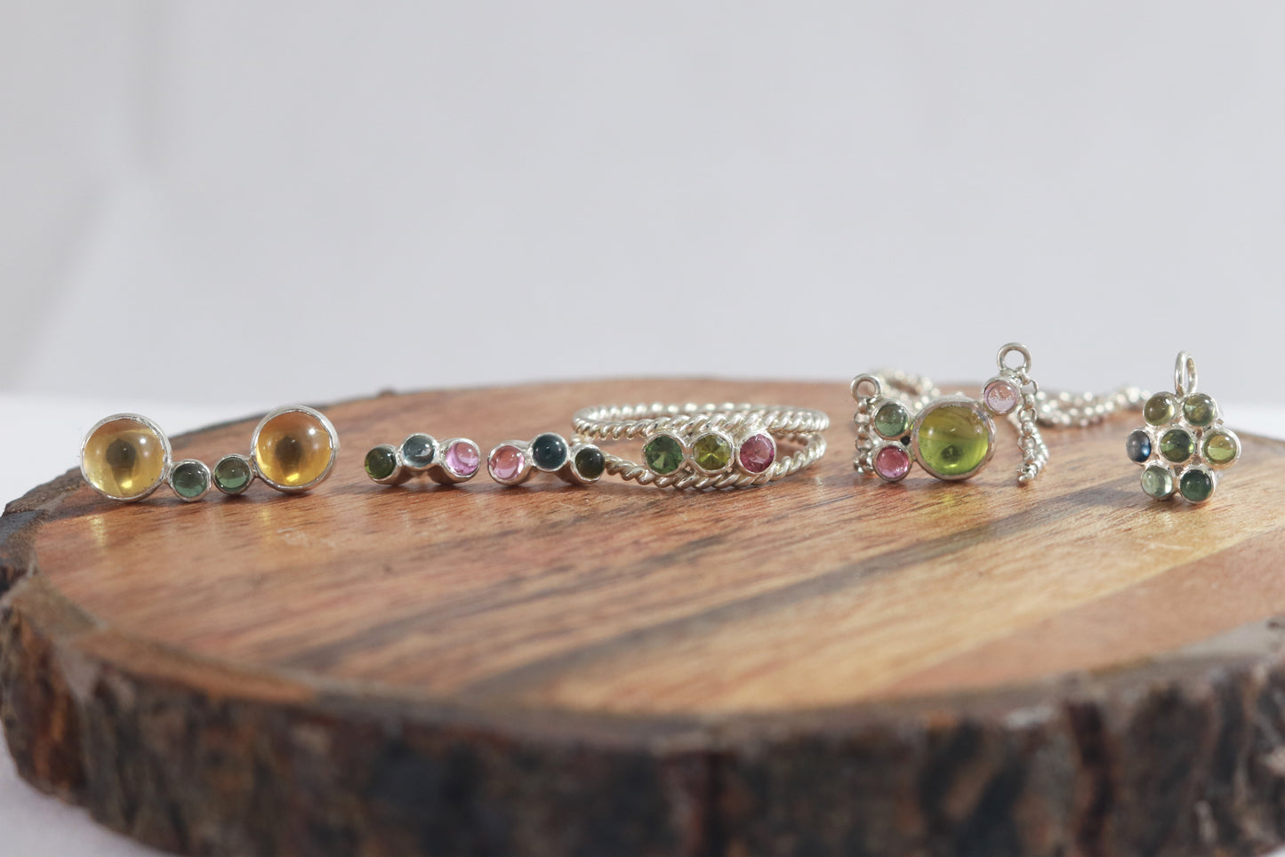 Round natural peridot & tourmaline gemstones set in sterling silver in a cluster on a sterling silver chain.