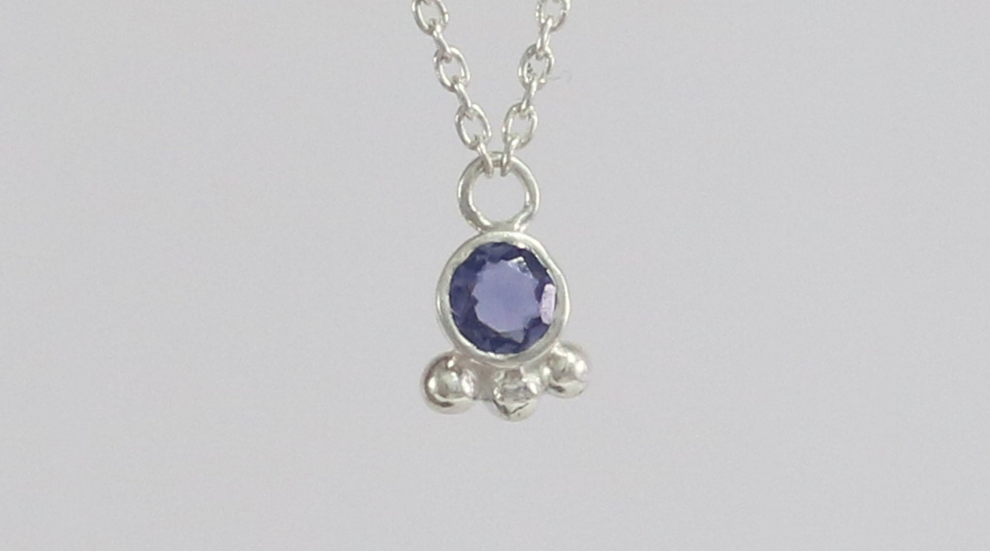 Natural gemstone set in sterling silver bezel with 3 silver bubble accents on a sterling silver chain.
