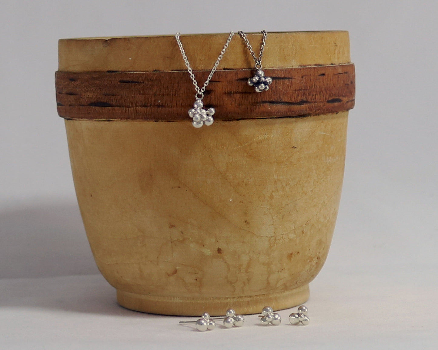 Stud earrings with three sterling silver bubbles in a pyramid.