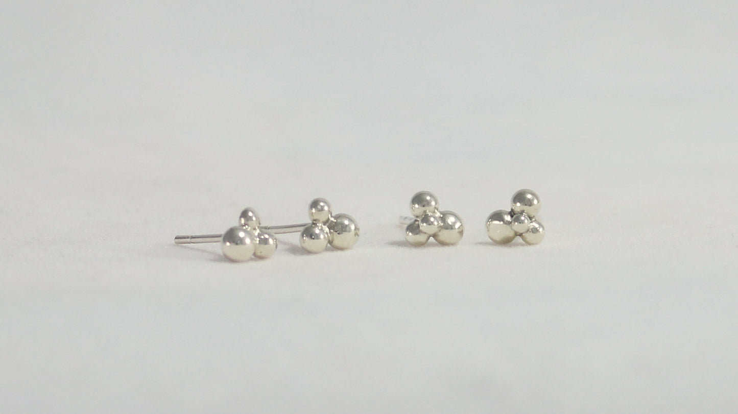 Stud earrings with three sterling silver bubbles in a pyramid.