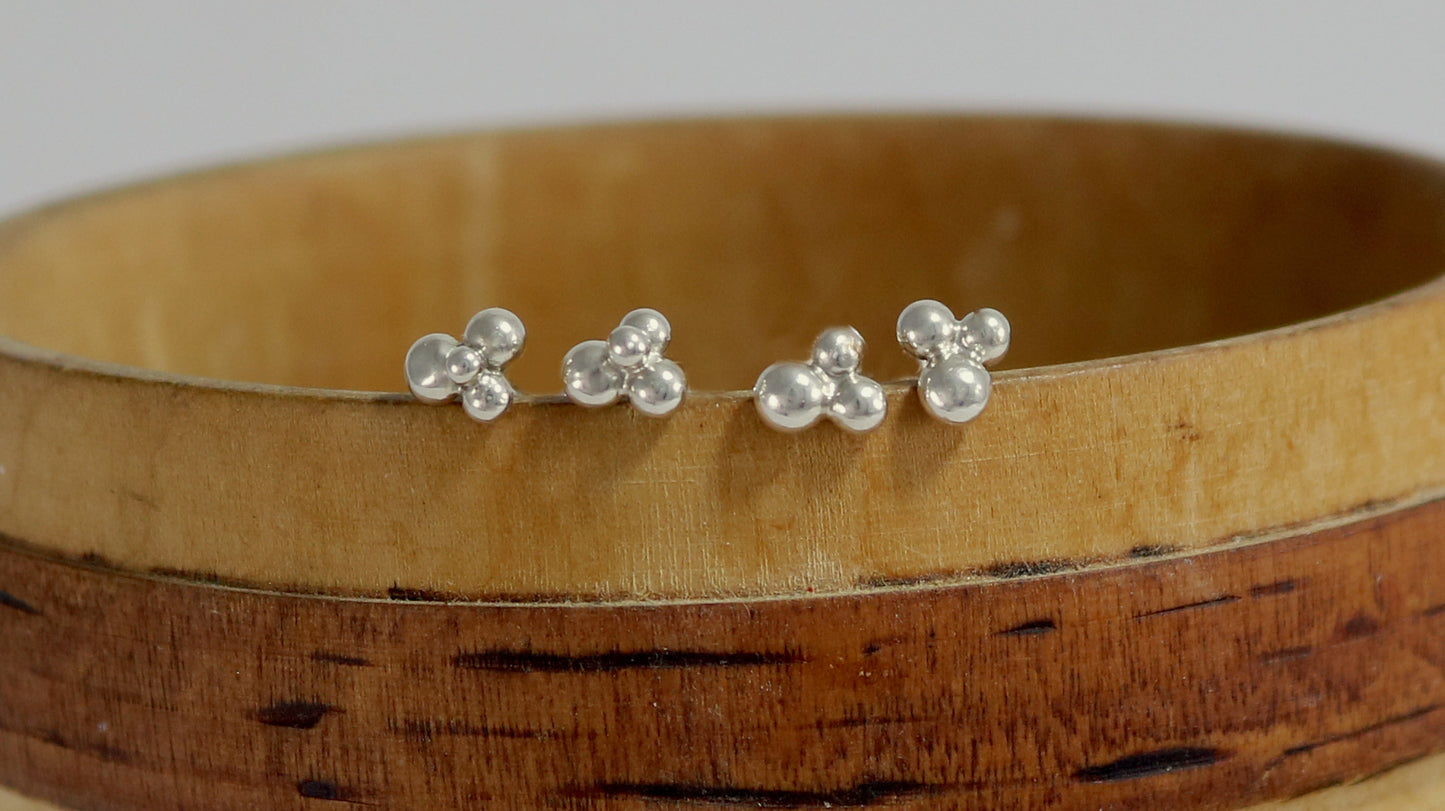 Stud earrings with three sterling silver bubbles in a pyramid.