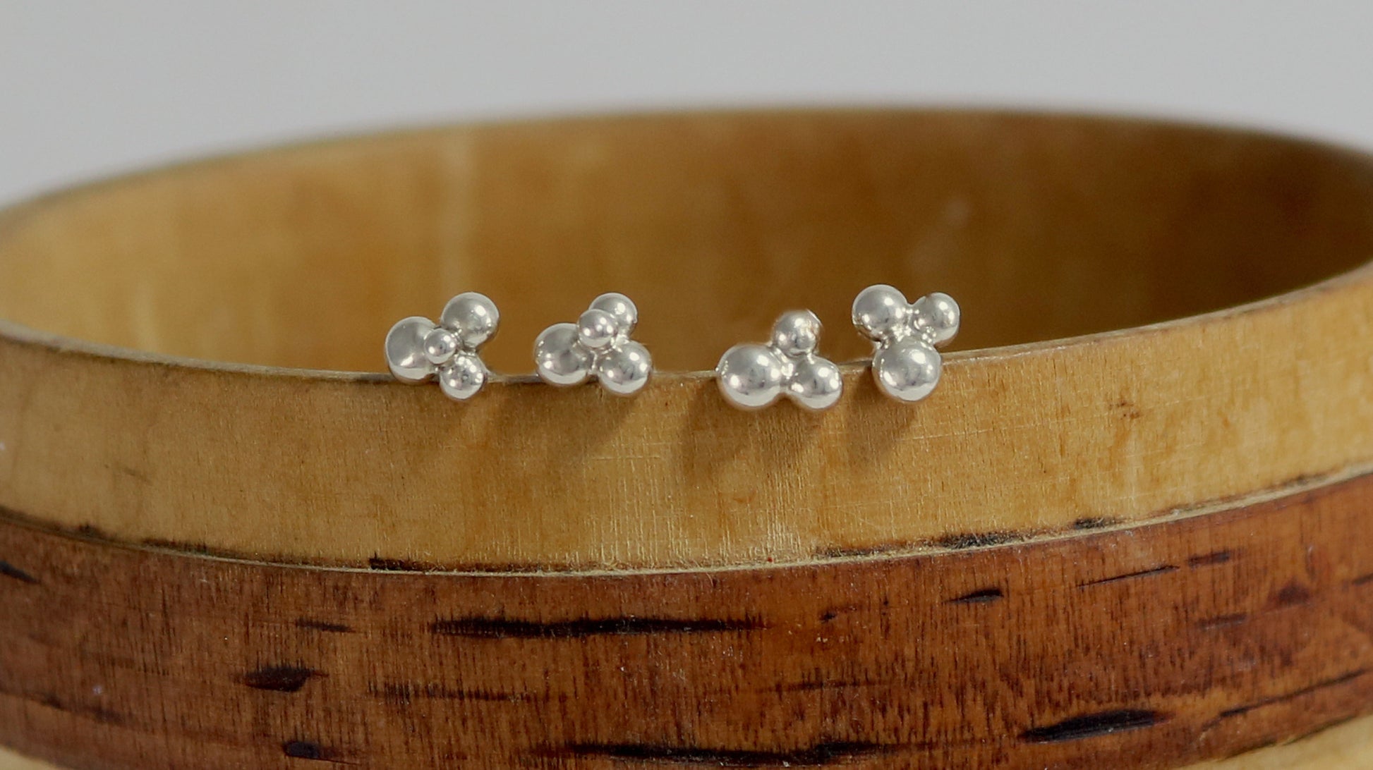 Stud earrings with three sterling silver bubbles in a pyramid.