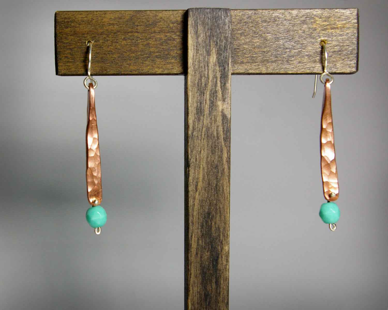 Hammered copper bar dangle earrings with turquoise glass bead.