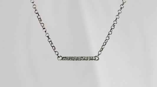 Solid sterling silver chain with a textured 15mm silver bar. 