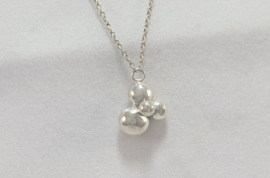 A stylish cute cluster of 4 sterling silver bubbles on a sterling silver chain.