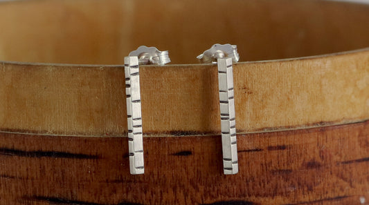 1.5mm thick solid sterling silver, rectangle bar studs with randomly spaced black lines.
