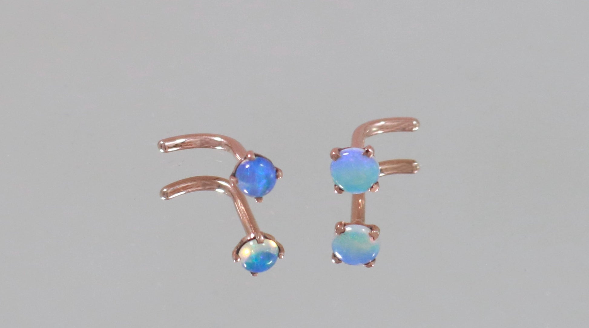 Rose gold nose studs with blue opals set with prongs