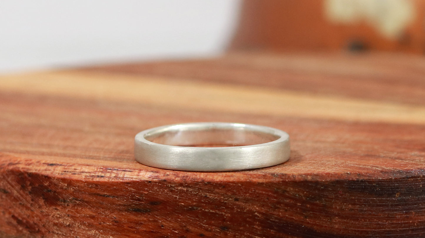 A sterling silver ring band with a matte finish outside & polished finish inside, 3mm wide, 1.7mm thick.