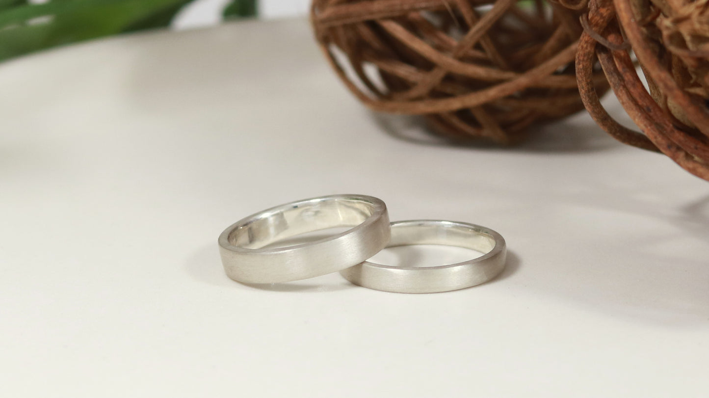 Two sterling silver ring bands with a matte finish outside & polished finish inside, one is 3mm wide, 1.7mm thick and one is 4mm wide, 1.7mm thick.