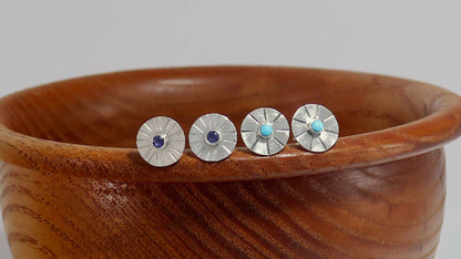 Sterling silver disc stud earrings with a natural round gemstone that has sunburst lines.