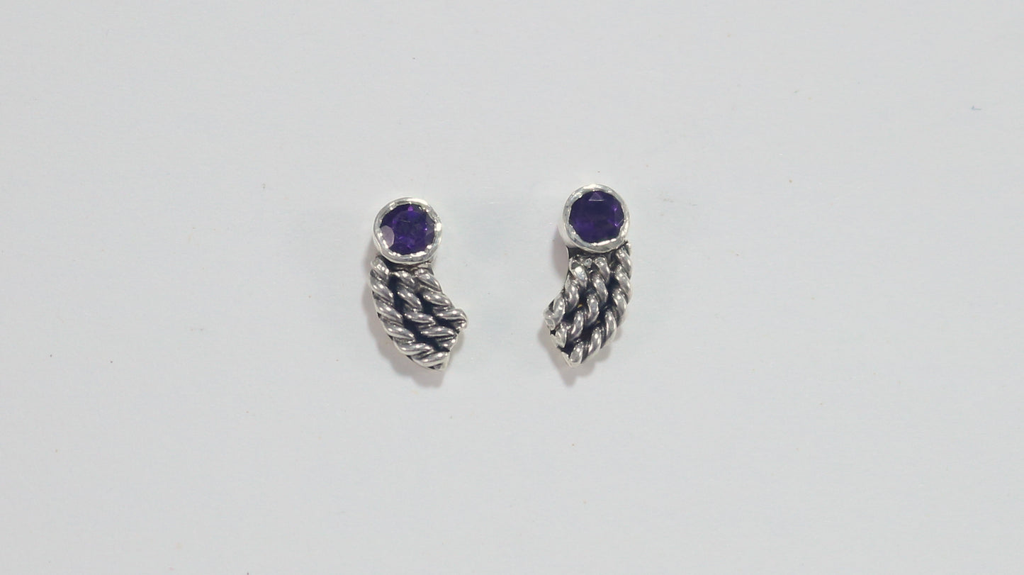 Stud earrings, round natural gemstones set in sterling silver bezels with silver, curved twisted tails meant to be worn two ways. 