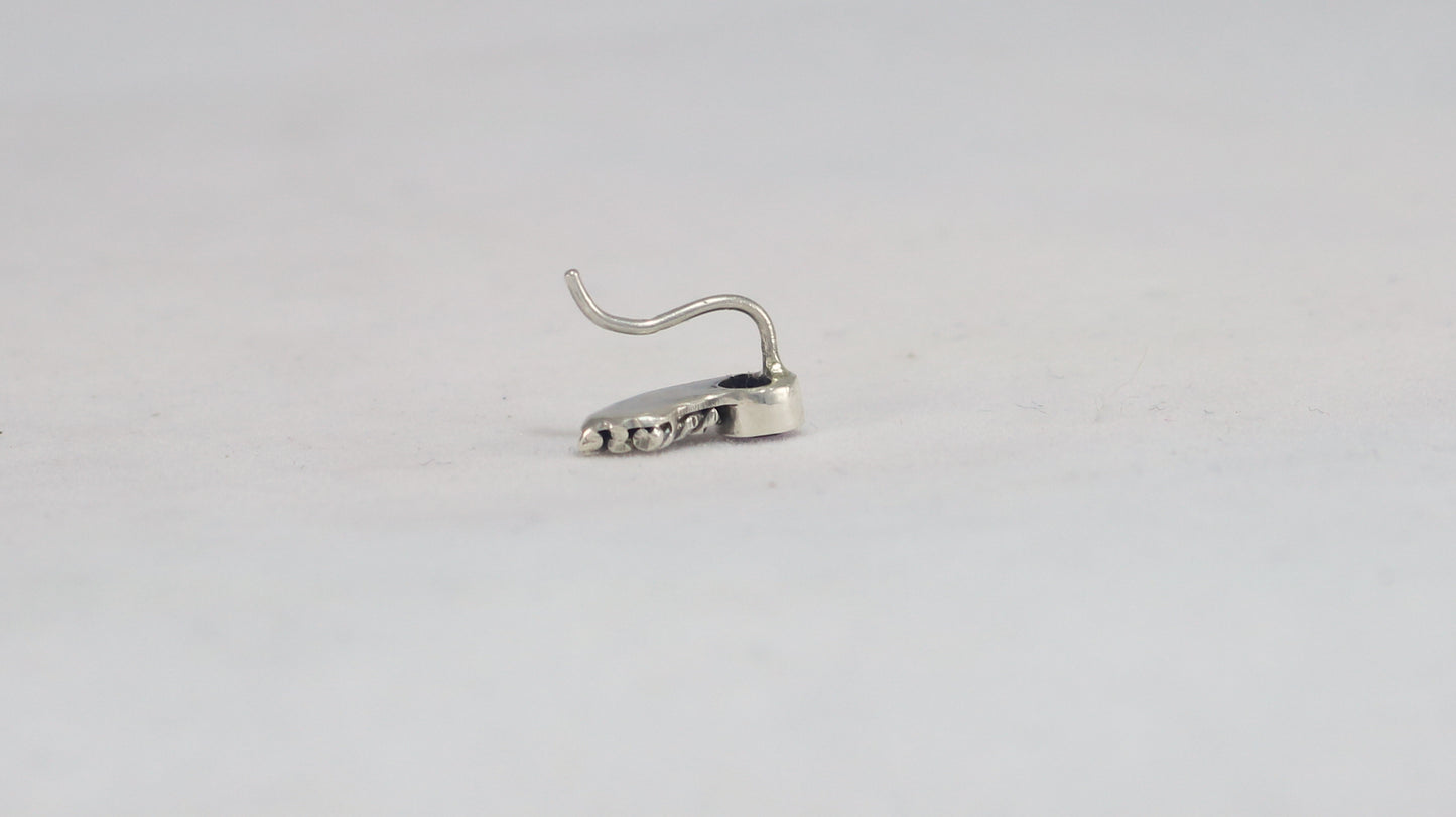 Stud earrings, round natural gemstones set in sterling silver bezels with silver, curved twisted tails meant to be worn two ways. 