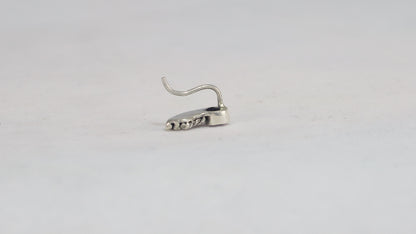 Stud earrings, round natural gemstones set in sterling silver bezels with silver, curved twisted tails meant to be worn two ways. 