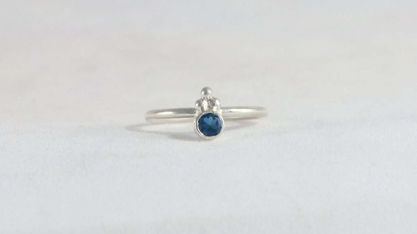 Natural gemstone set in sterling silver bezel, silver bubble pyramid accents on sterling silver ring band.