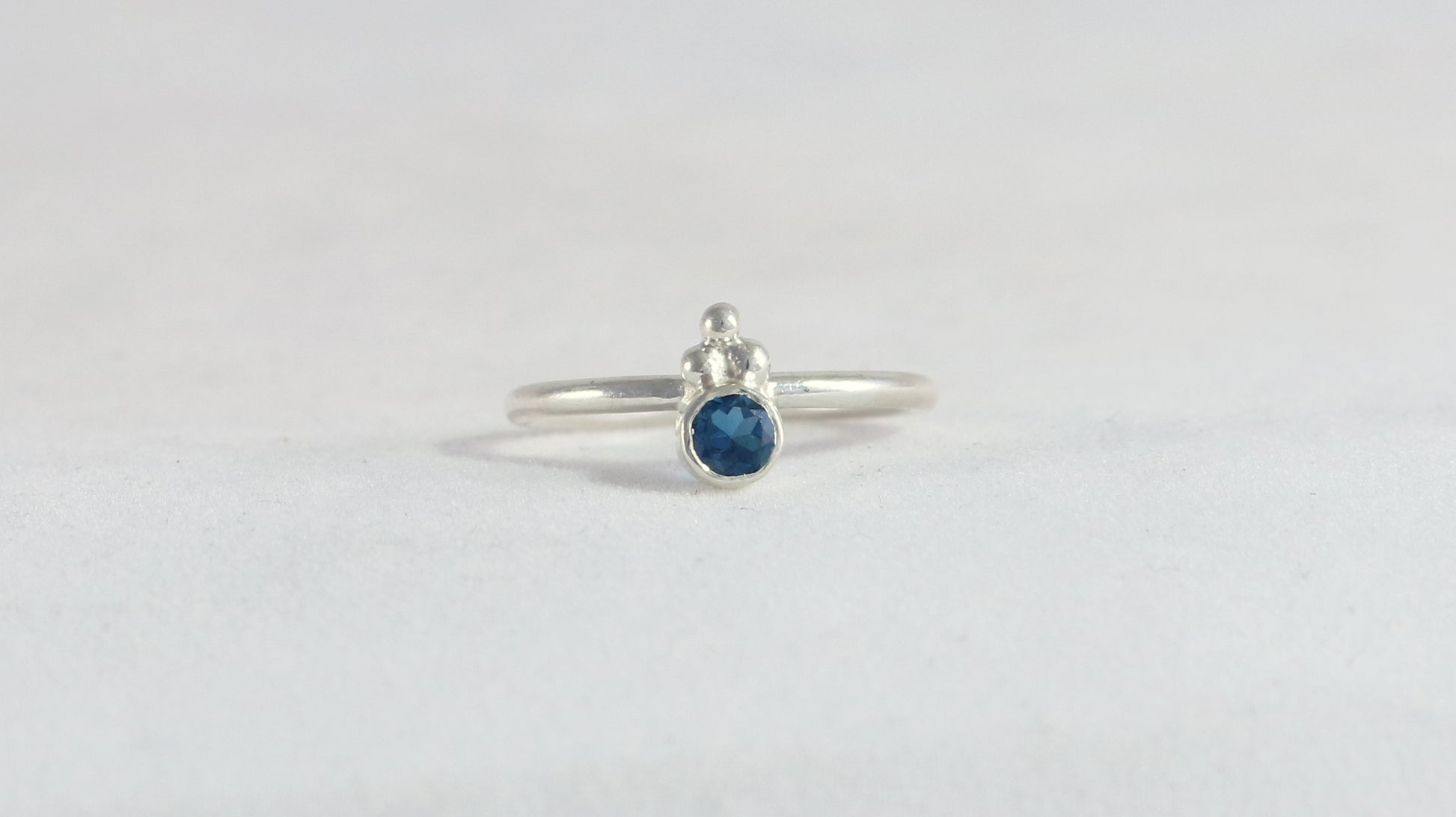 Natural gemstone set in sterling silver bezel, silver bubble pyramid accents on sterling silver ring band.