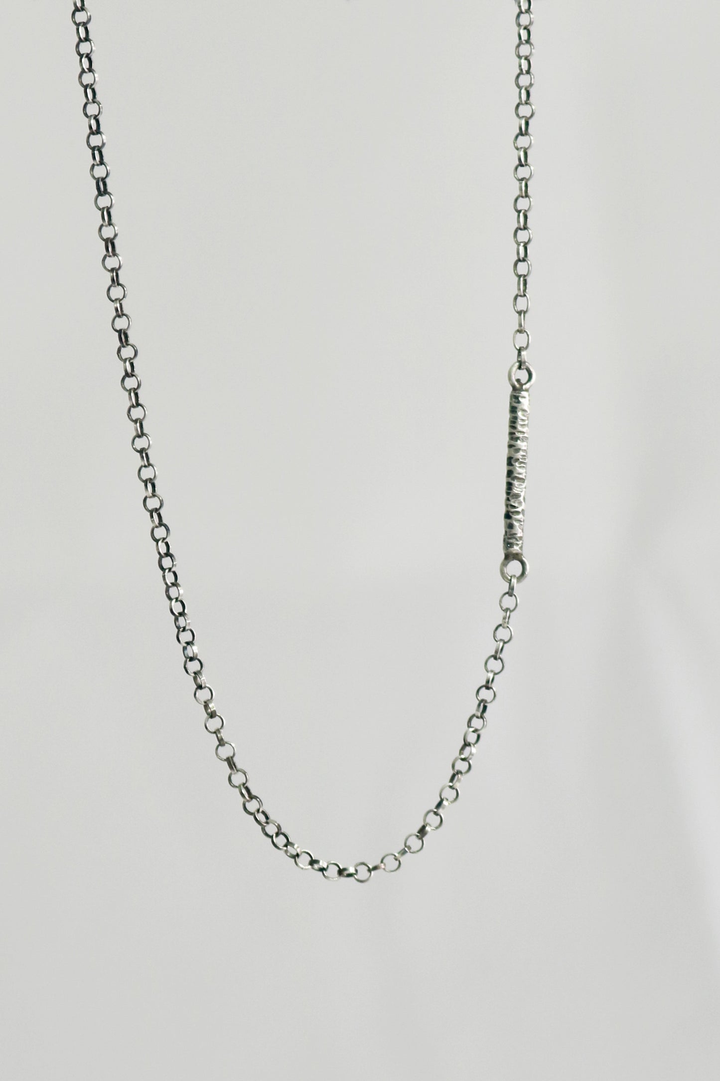 Solid sterling silver chain with a textured 15mm silver bar. 