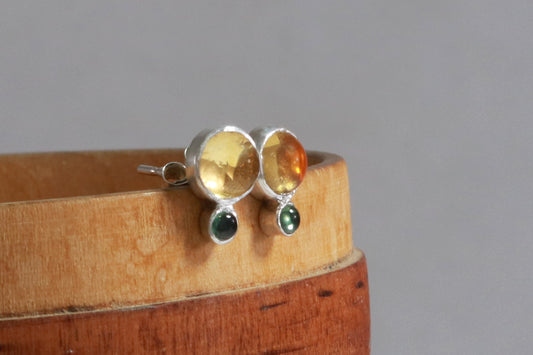 Stud earrings, natural round citrine gemstones set in sterling silver bezels with a small natural green tourmaline bezel set below.