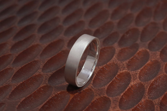 A sterling silver ring band with a matte finish outside & polished finish inside, 6mm wide, 1.7mm thick.