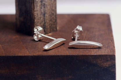 Studs made from solid sterling silver, shaped like a pointed ellipse.