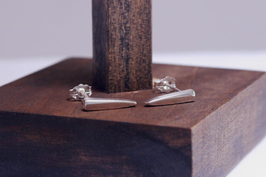 Sterling silver stud earrings shaped like spikes.