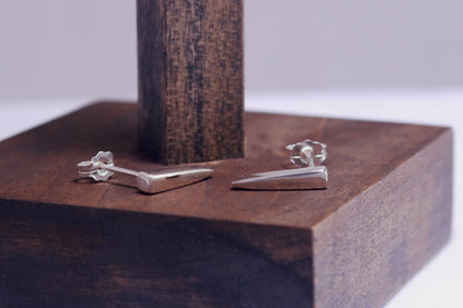 Sterling silver stud earrings shaped like spikes.