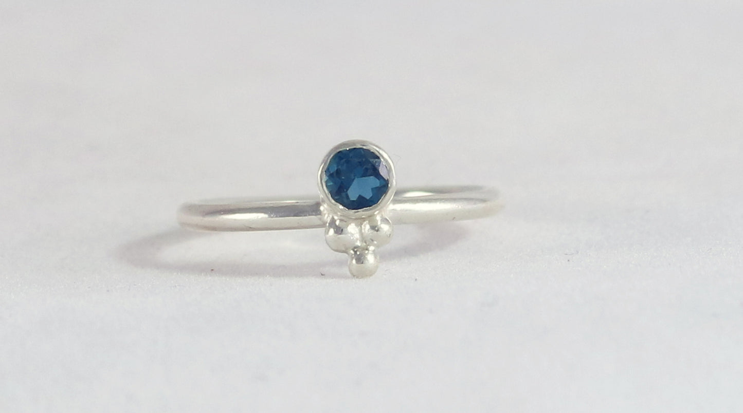 Natural gemstone set in sterling silver bezel, silver bubble pyramid accents on sterling silver ring band.