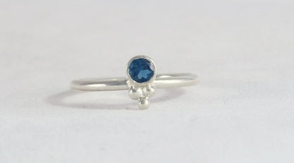 Natural gemstone set in sterling silver bezel, silver bubble pyramid accents on sterling silver ring band.