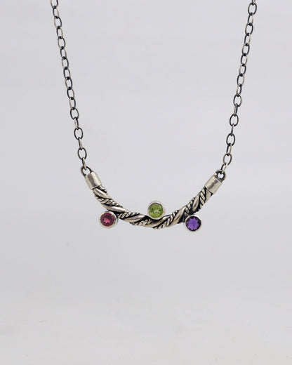 Curved solid sterling silver twisted pendant with 3 bezel set gemstones