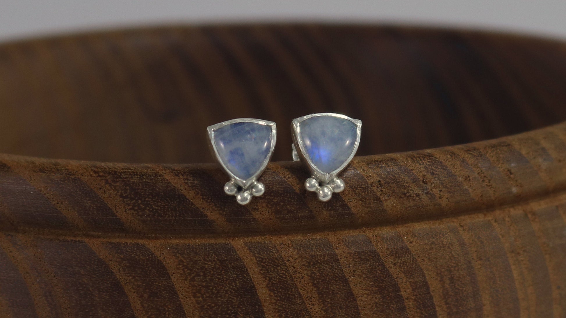 Natural trillion gemstones set in sterling silver bezel with 3 silver bubble accents, stud earrings.